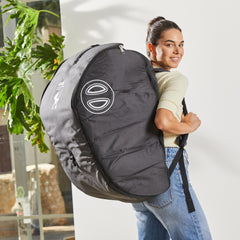 DOONA padded travel bag used at airport, guard against bumps.