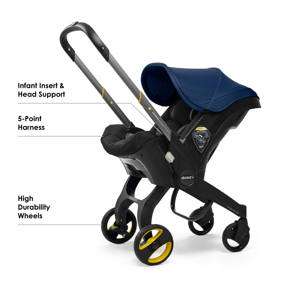 Doona stroller royal blue in use during a stroll outdoors.