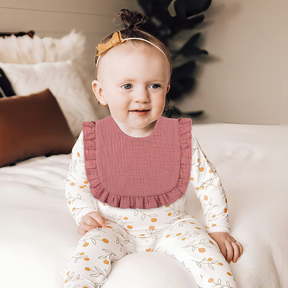 DOSMINE muslin baby bib on-baby-wear demonstrates comfortable coverage during feedings and teething.