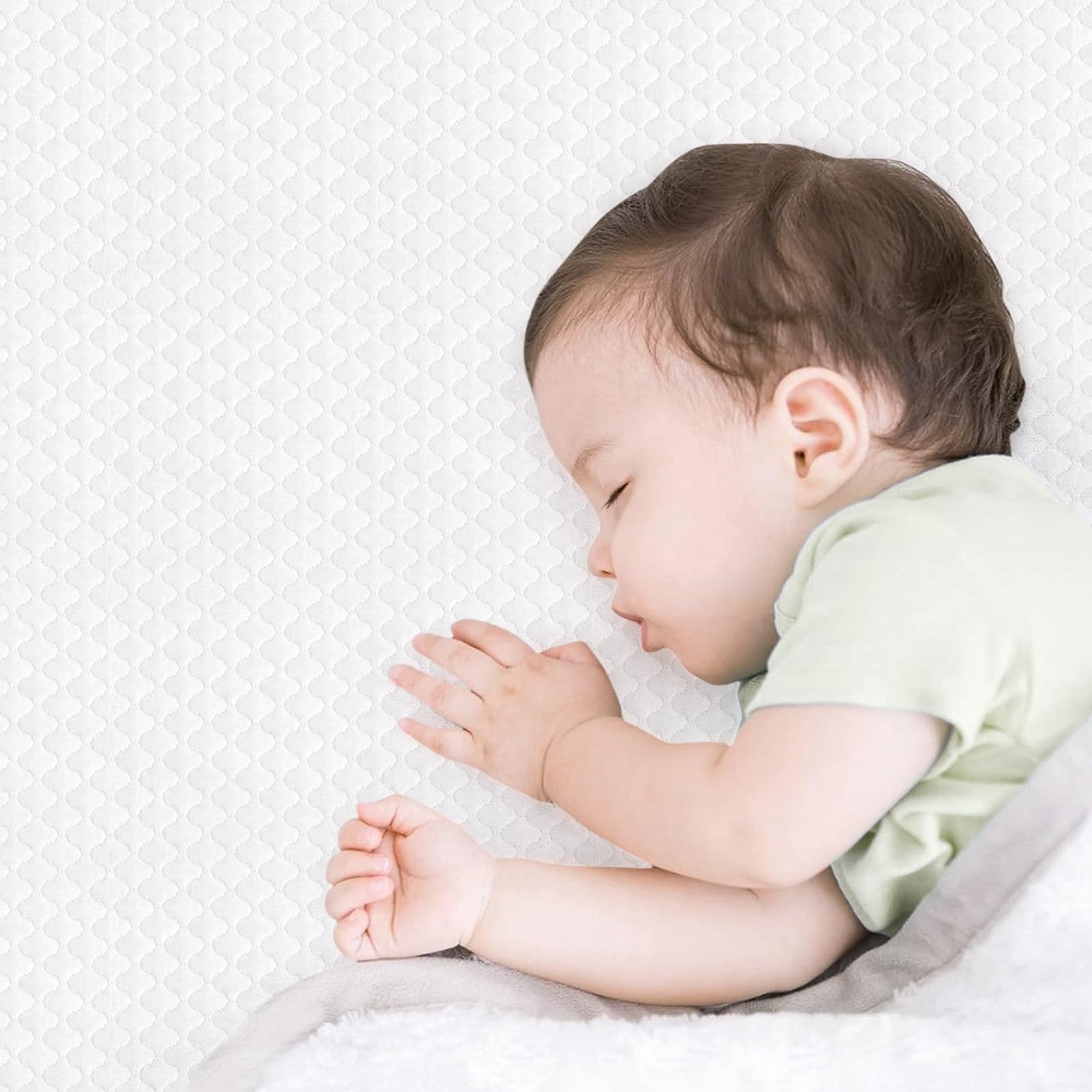 Dourxi crib mattress in standard crib ready for transition.