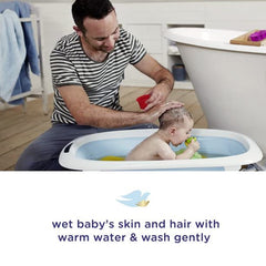 Dove Baby Tear Free Shampoo bottle detail emphasizes tear-free formula for delicate eyes.