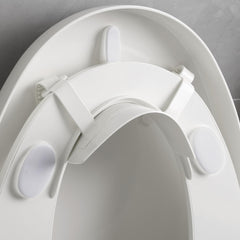 Doytn universal pee deflector on a toilet seat preventing splash and mess.