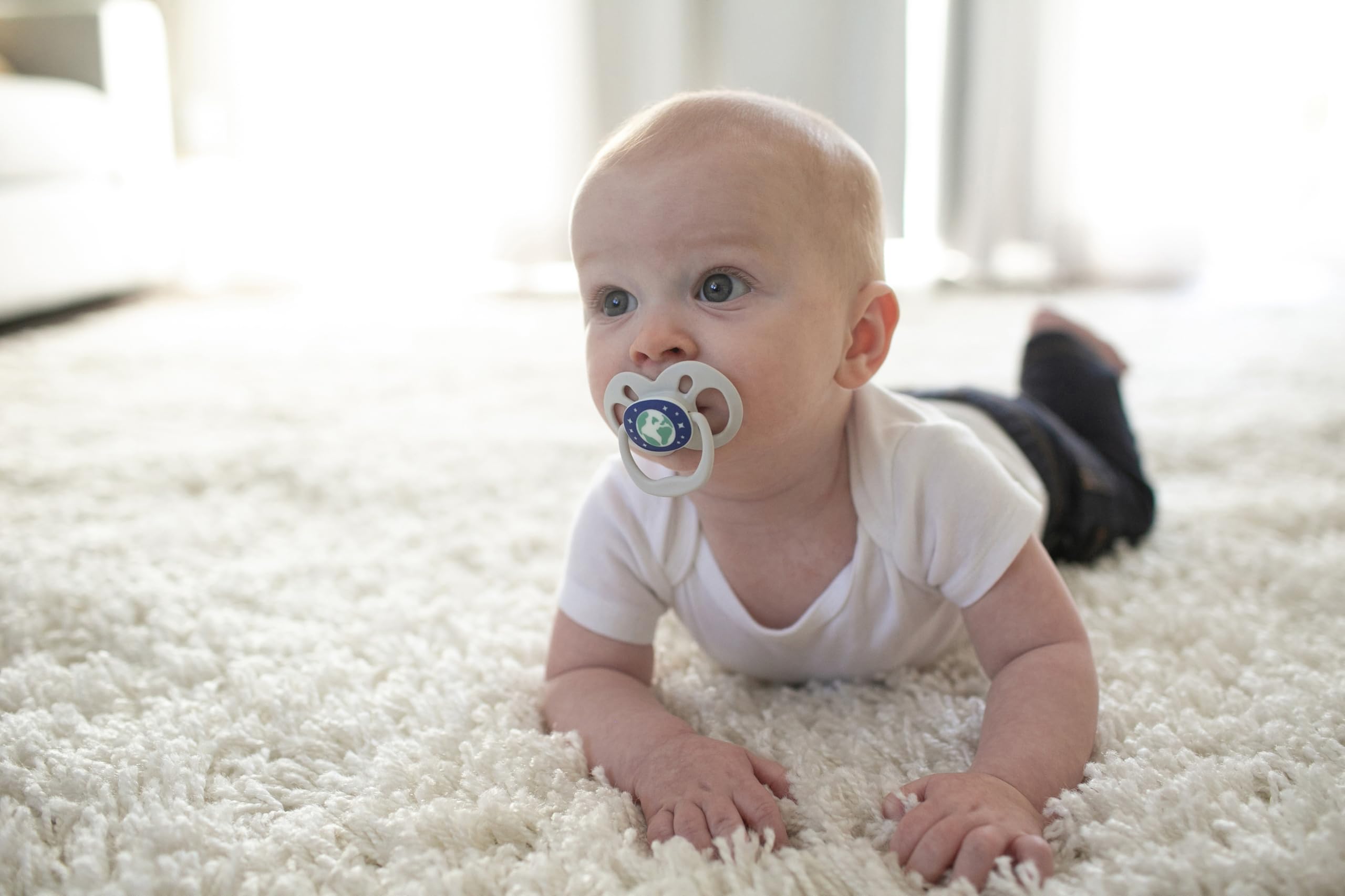 Dr. Brown's Advantage Glow pacifier two-stage design supports growing babies 6-18m.