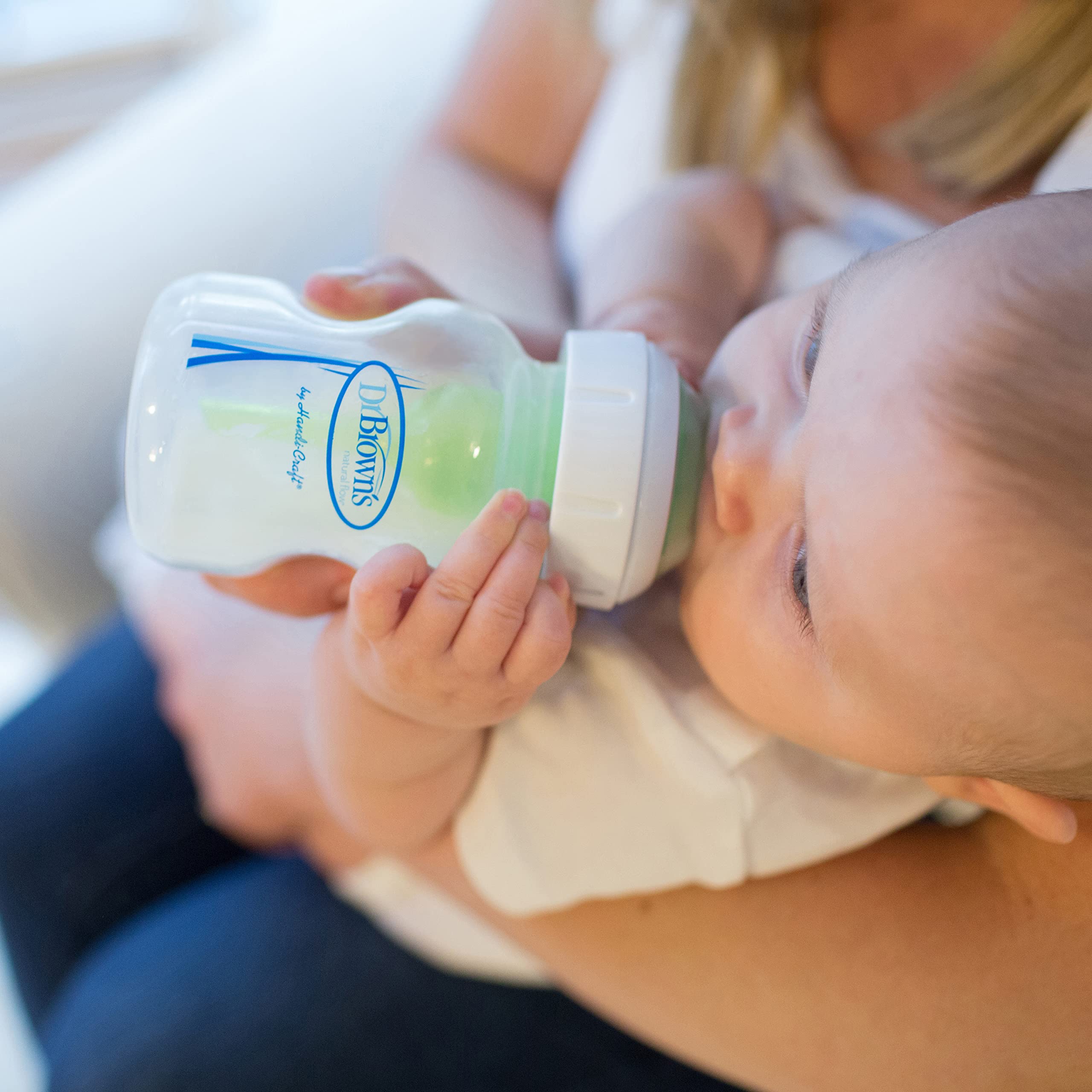 Dr. Brown's anti-colic vent night feed setup shows a calm feeding session