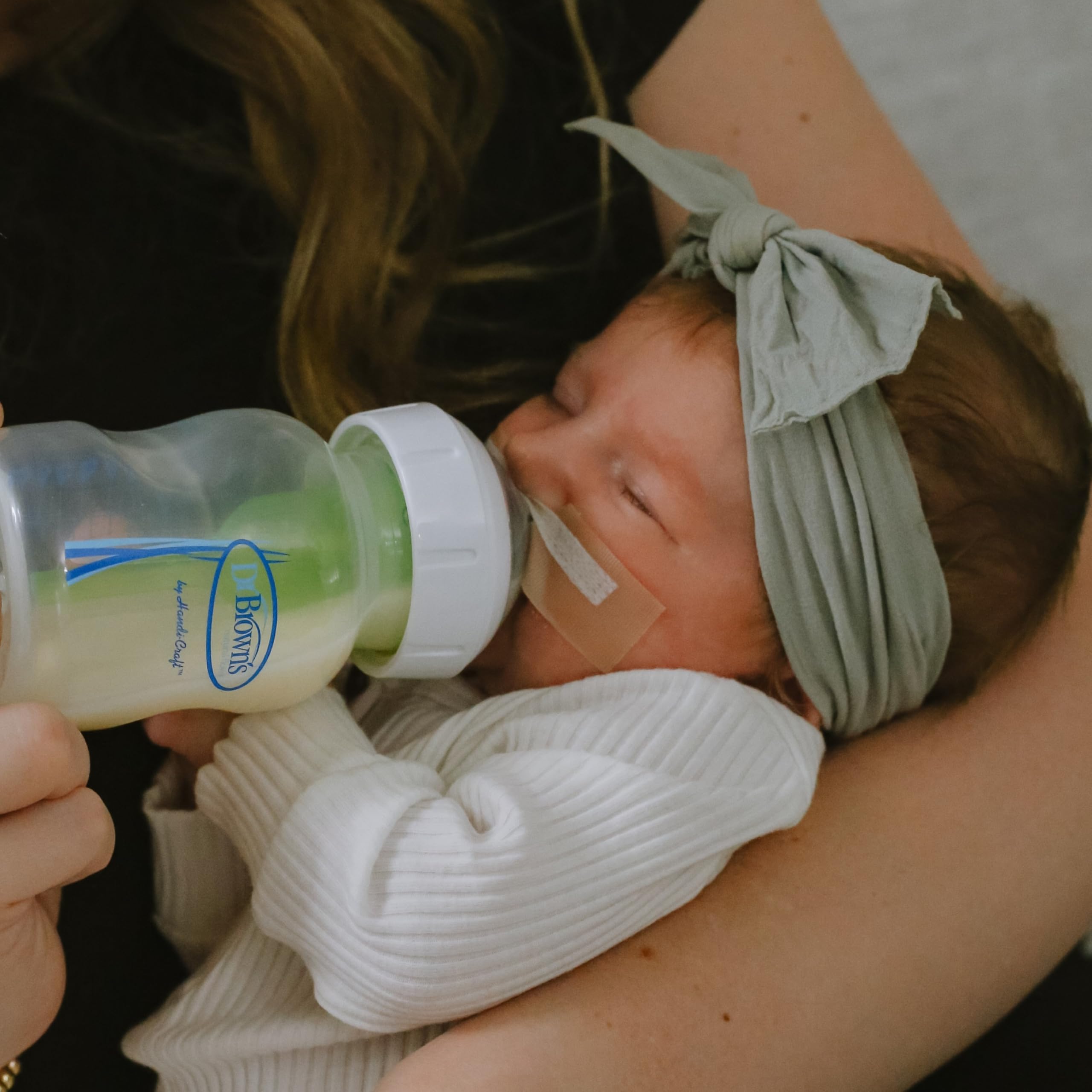 Dr. Brown's Infant-Paced Feeding Valve inserted into a Wide-Neck nipple for regulated flow