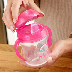 Dr. Brown's Milestones sippy cup lid folded back during drinking