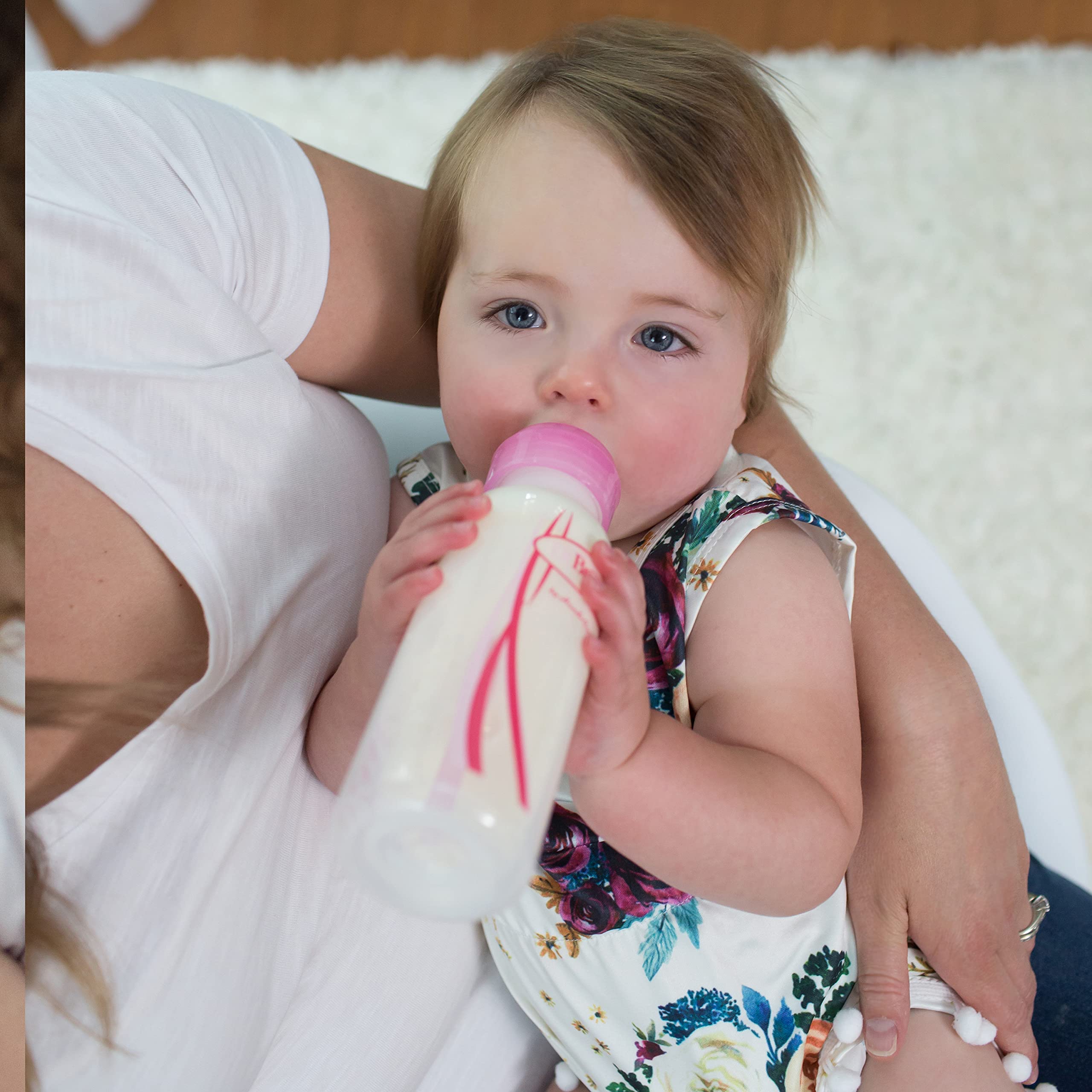 Dr. Brown's pink bottle visual set supports phased feeding routines for growing babies.