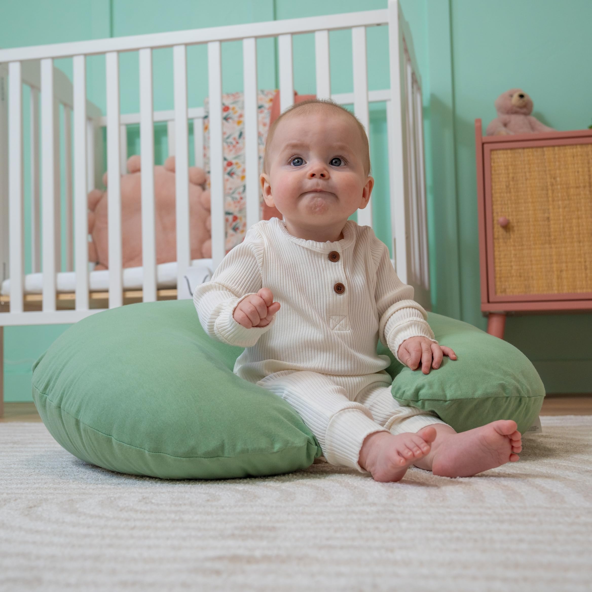 Dr. Mama's Organics nursing pillow washable-cover for quick cleanup.