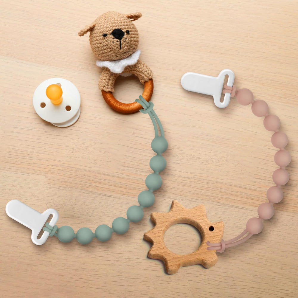 Draklary pacifier clips used on stroller or car seat for on-the-go use