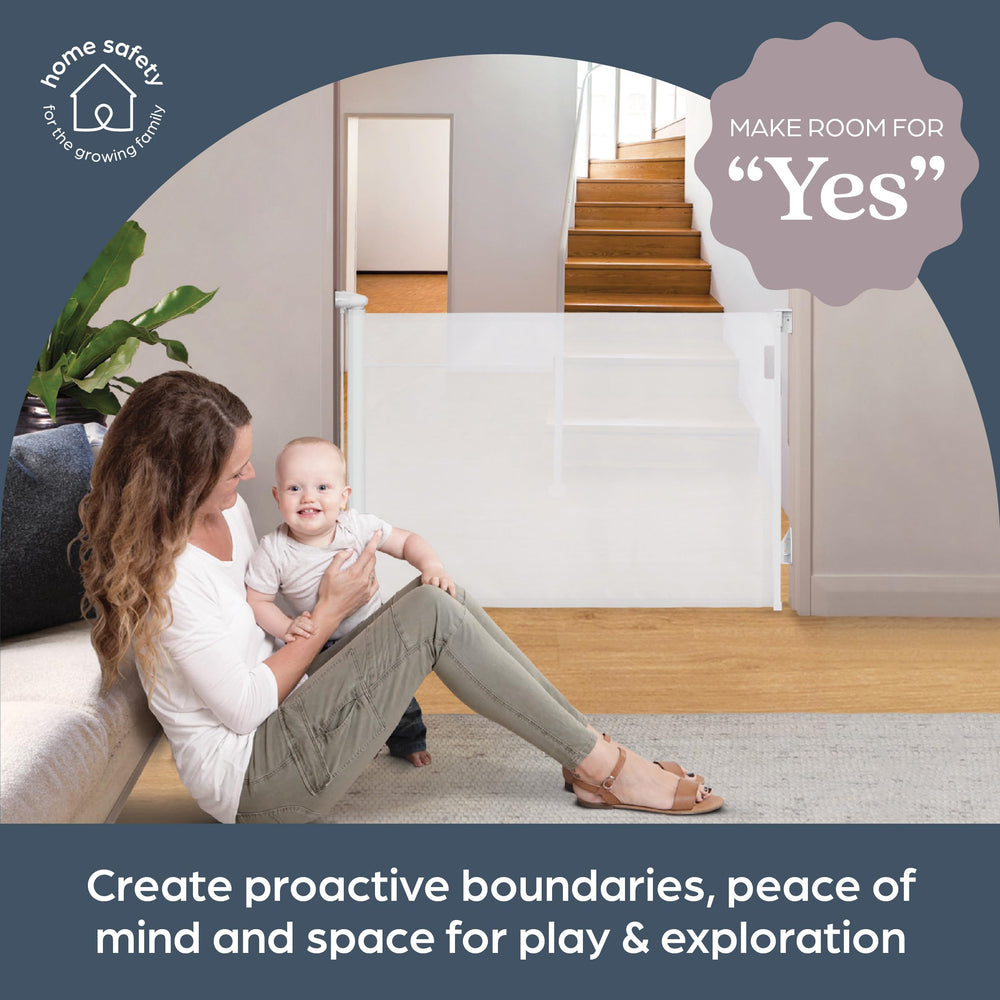 Dreambaby Glide N Hide on stairs demonstrates space-saving retractable operation in tight stairs.