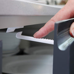Dreambaby Safety Catches in use showing pull to open and auto-lock action