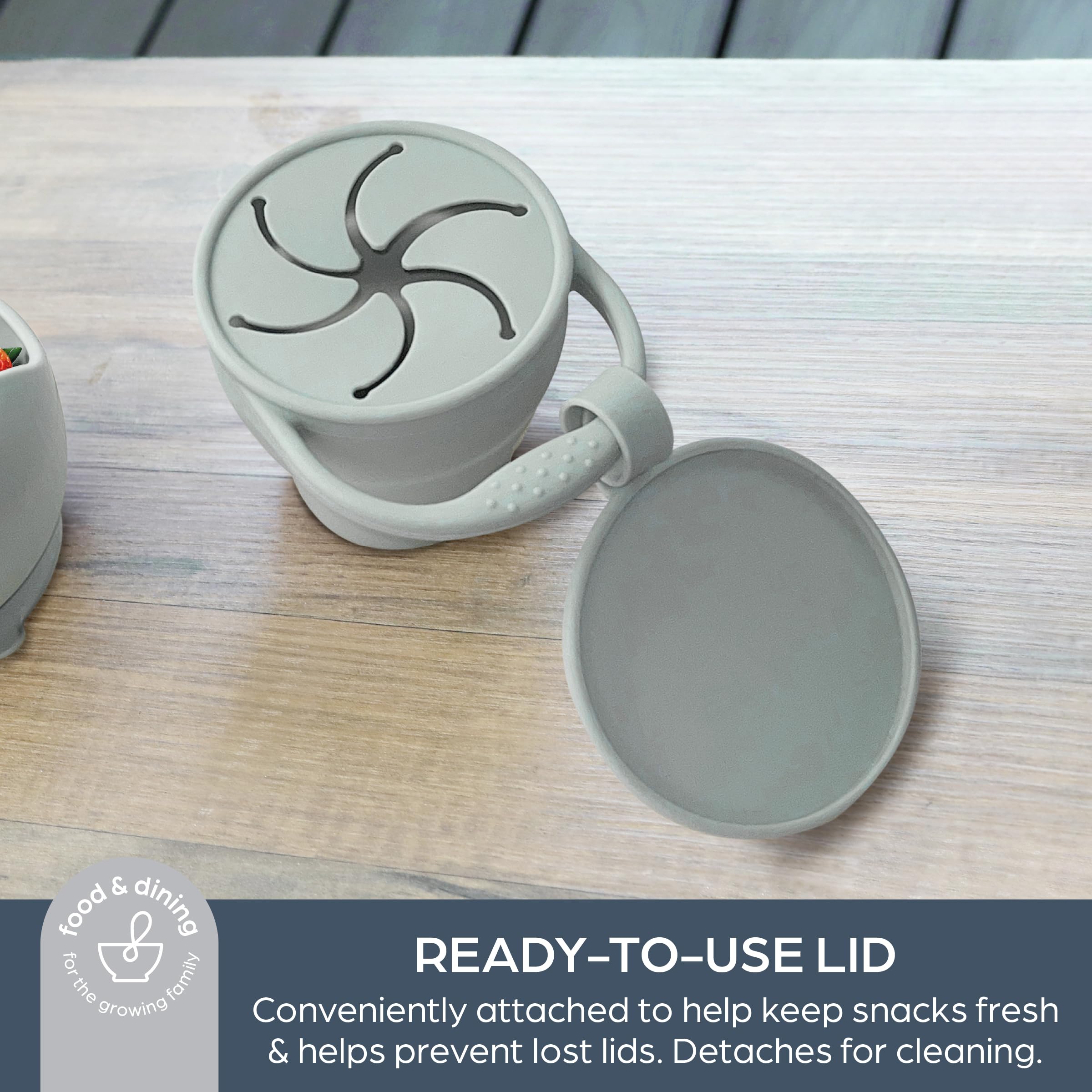 Dreambaby snack cup with integrated handle for easy toddler portability.