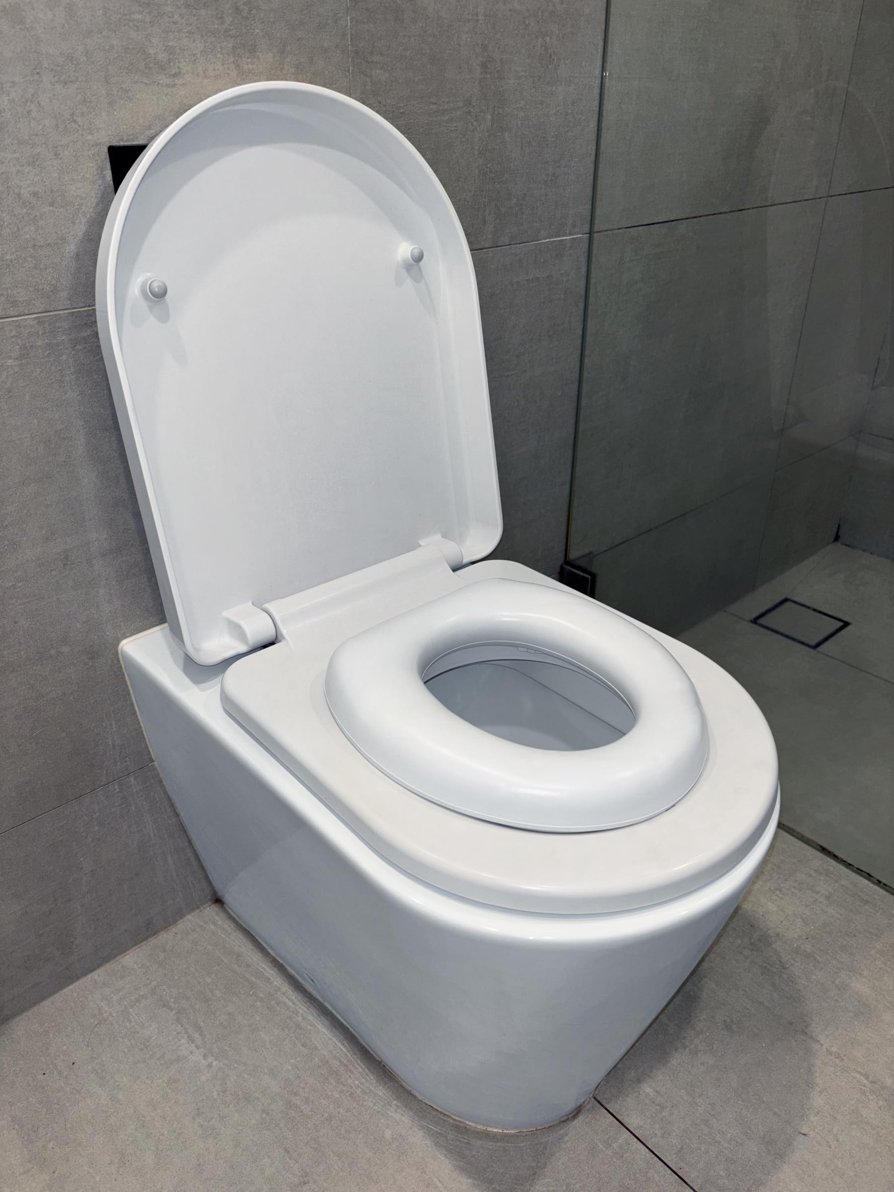 Dreambaby Soft Touch Potty Seat portable and lightweight for travel.