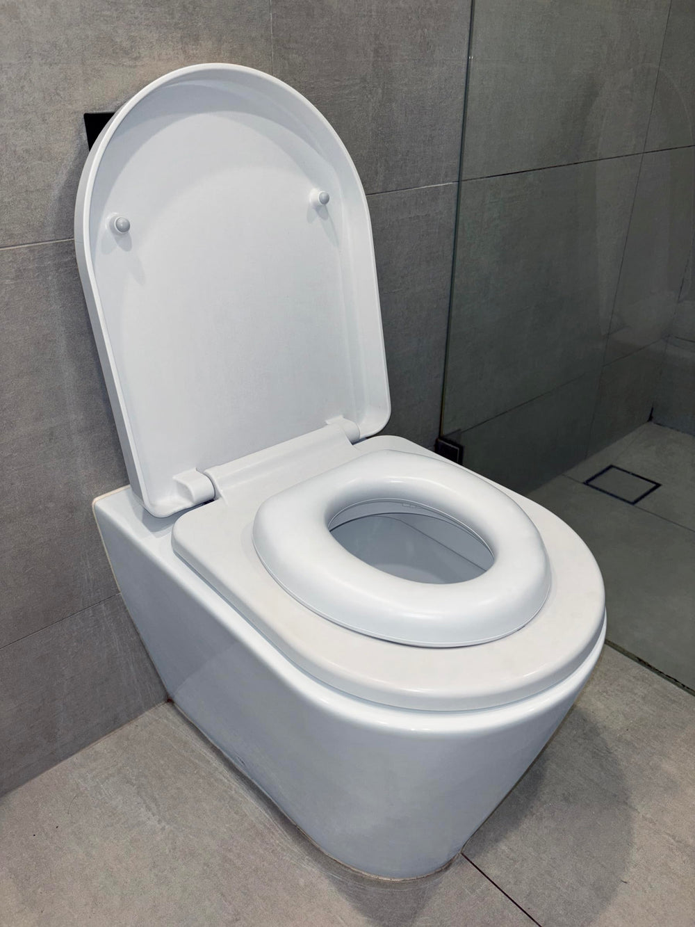 Dreambaby Soft Touch Potty Seat portable and lightweight for travel.