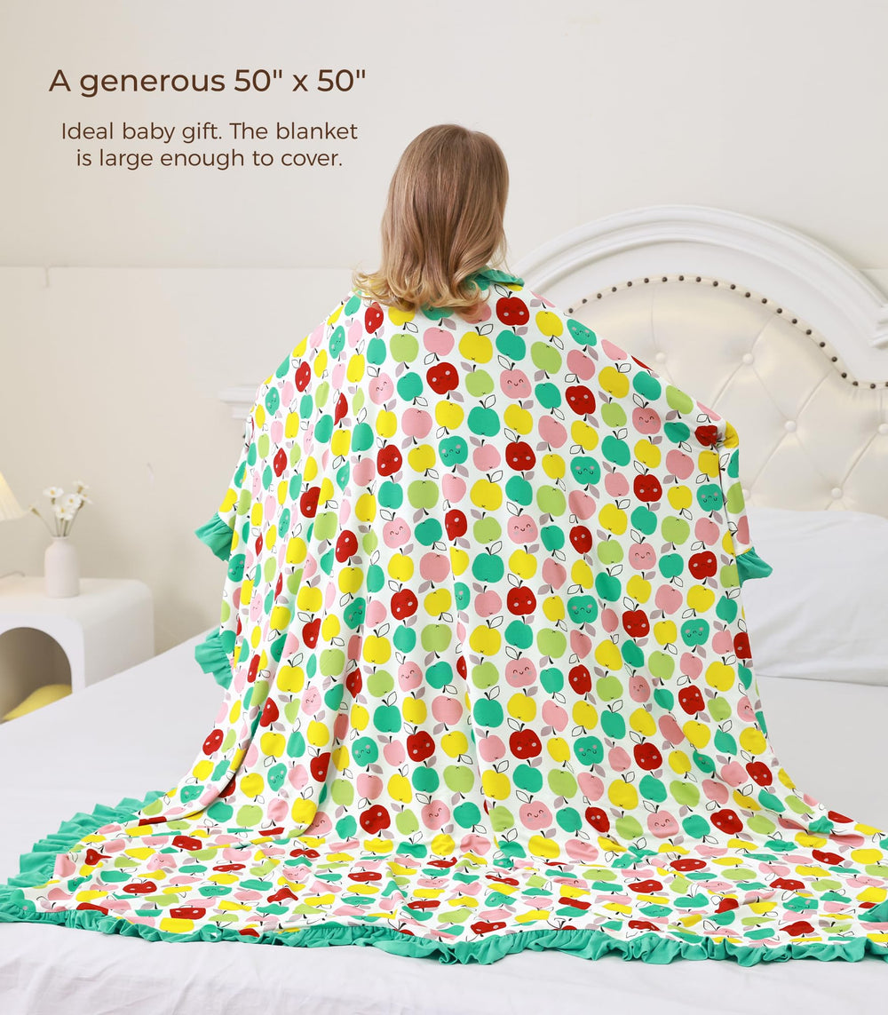 DREAMHALO Apple blanket in a stroller-ready travel setup for on-the-go use.