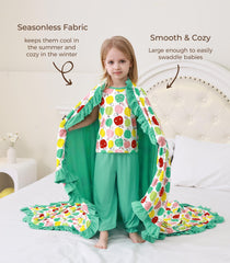 DREAMHALO Apple blanket used as swaddle wrap for versatile comfort.