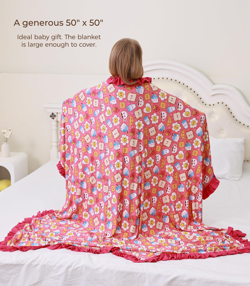 DreamHalo pink blanket in stroller during travel, lightweight and breathable for outings.