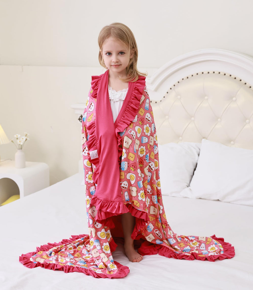 DreamHalo cooling pink blanket on bed, moisture-wicking fabric helps hot sleepers stay comfortable.