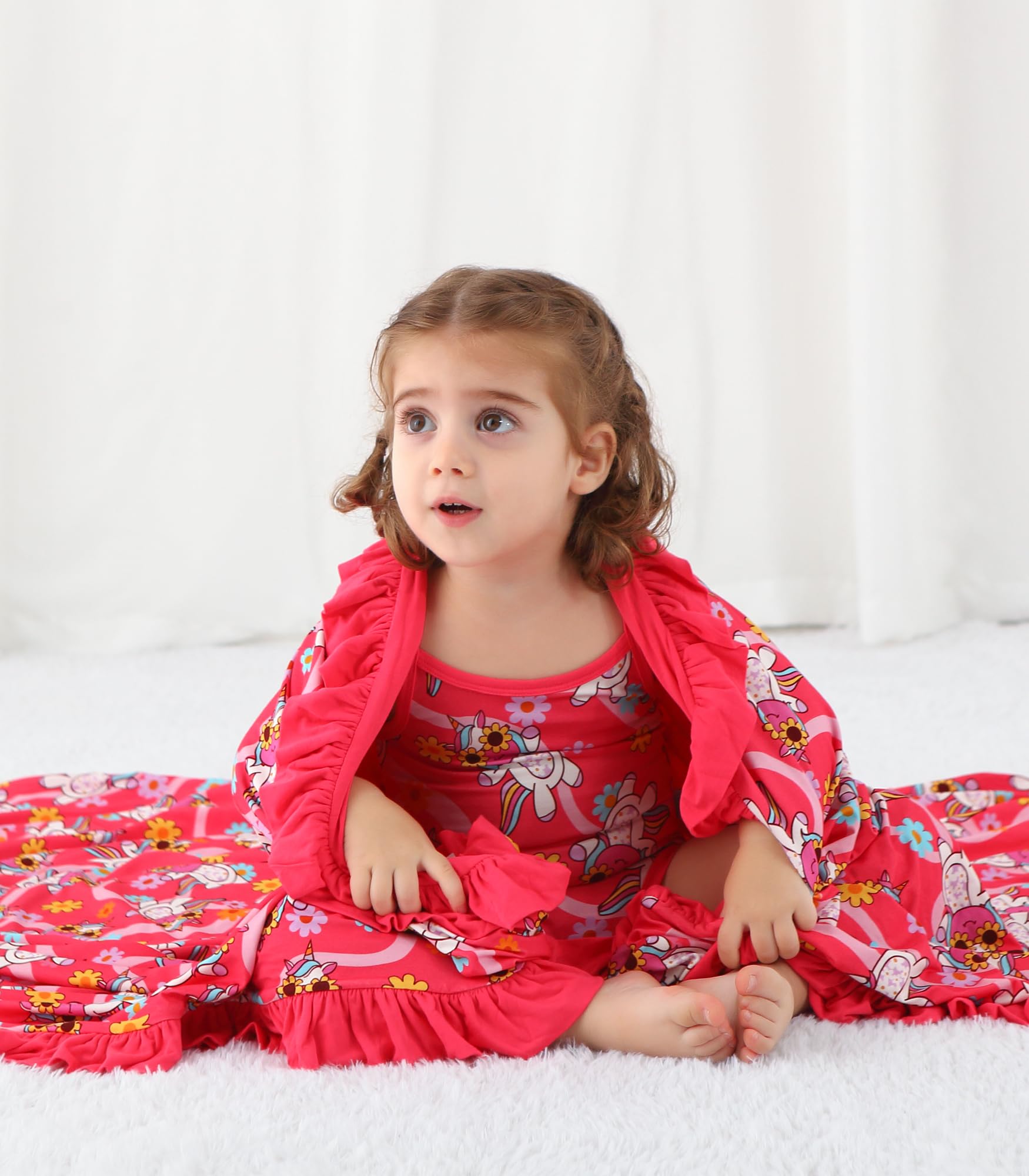DREAMHALO nursery blanket folded beside crib illustrates versatile care