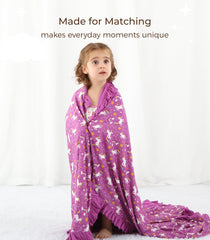 DREAMHALO purple unicorn nursery blanket on a crib adds playful charm and cozy warmth.