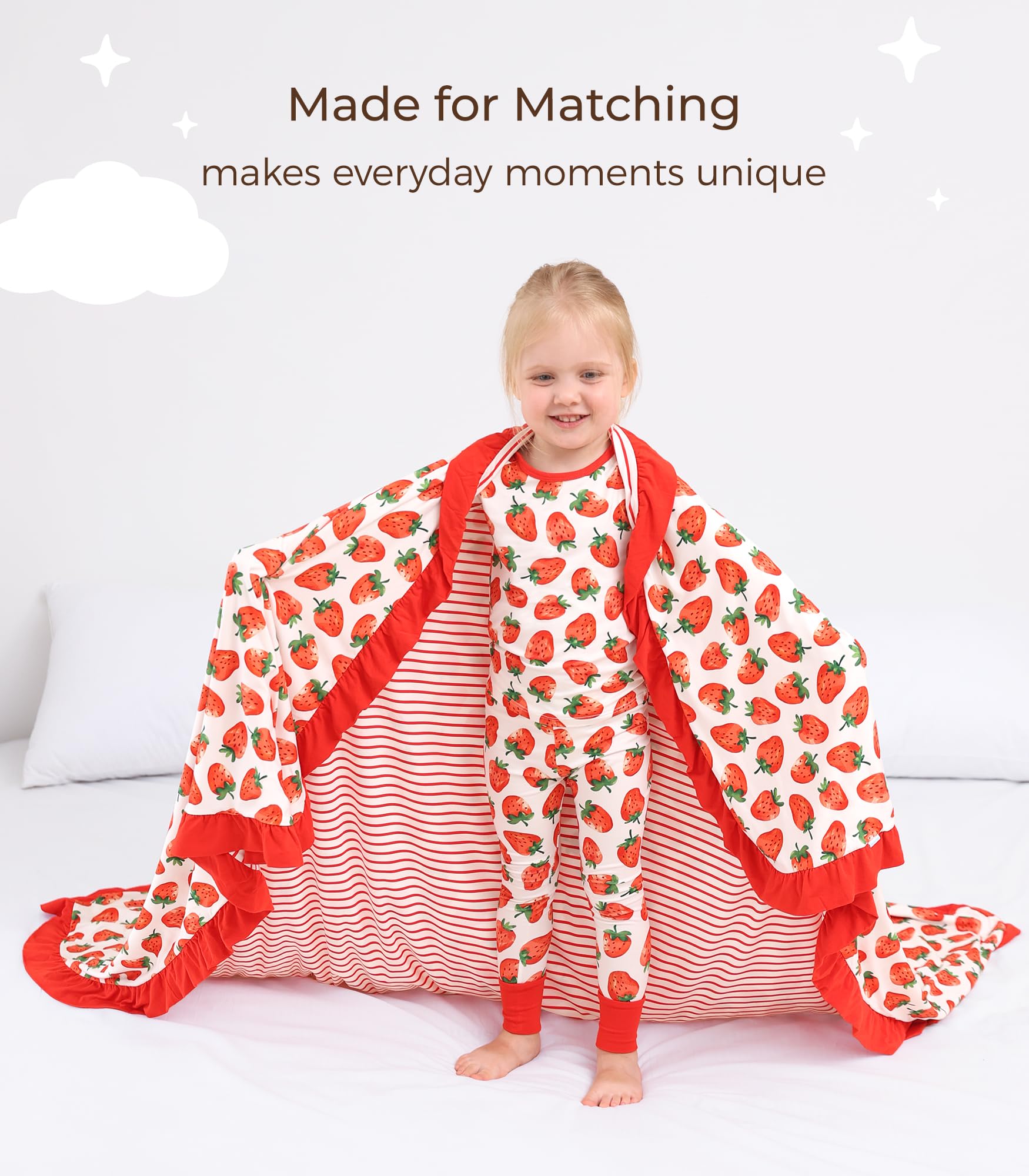 DREAMHALO Strawberry blanket in nursery crib demonstrates large size for growing babies