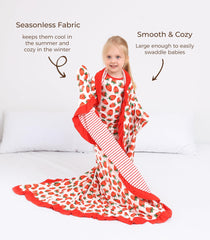 DREAMHALO Strawberry blanket swaddle image illustrates versatile use as swaddle or nursing wrap