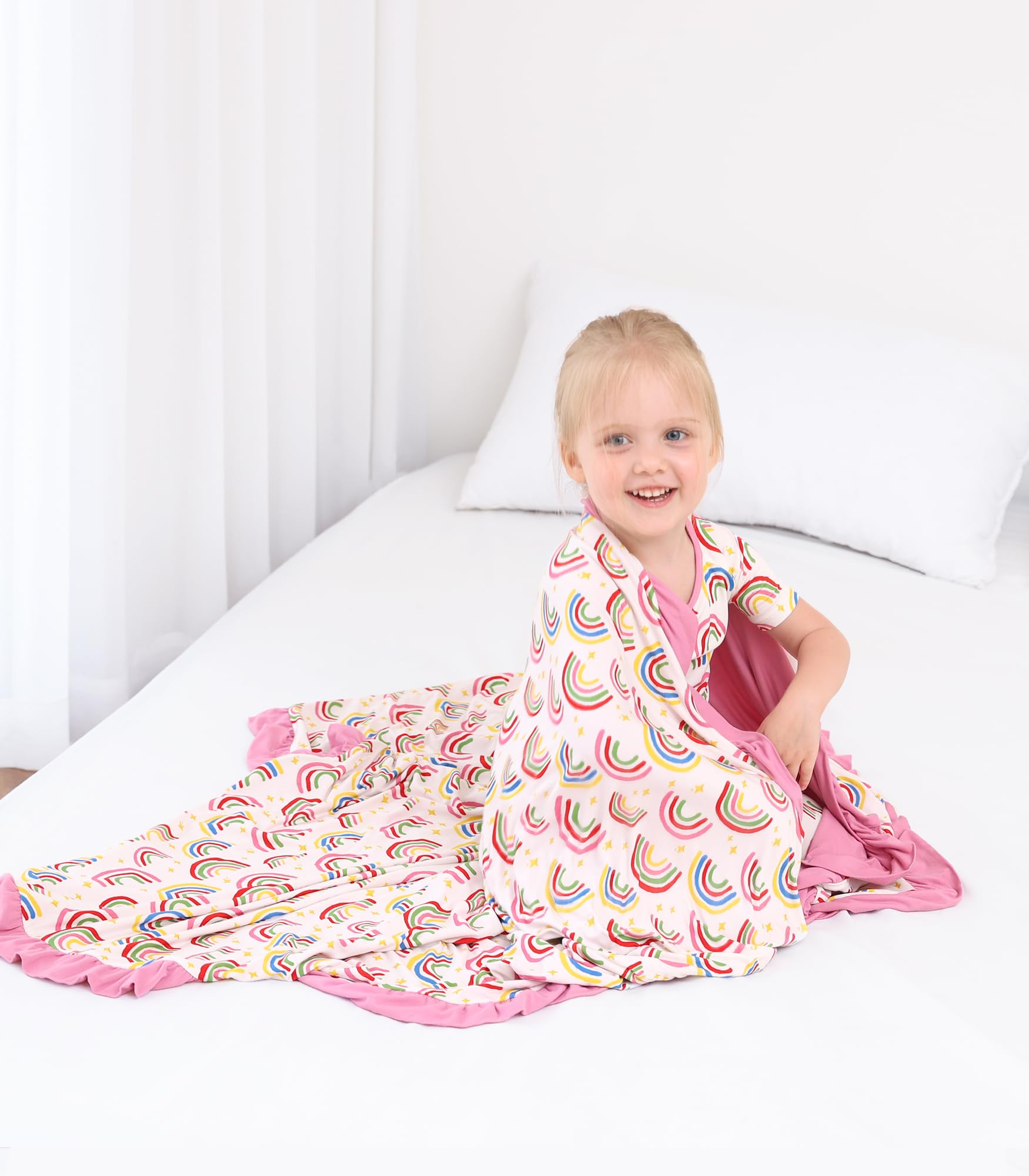 DREAMHALO travel blanket beside stroller for on-the-go versatility.