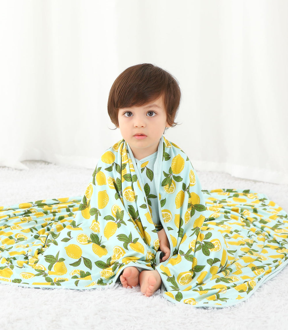 DREAMHALO travel wrap nursing moment illustrates versatile on-the-go use.