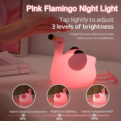Dreaming My Dream Flamingo Night Light in hand demonstrates portable, cordless design.