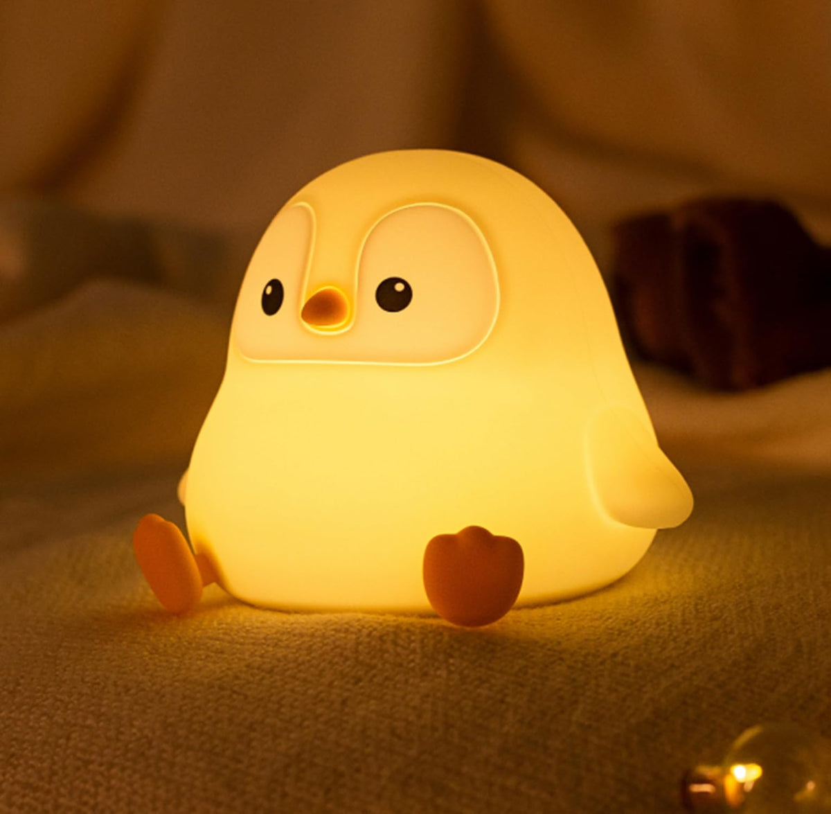DREAMING MY DREAM penguin night light front view, creates cozy bedside ambience for kids.