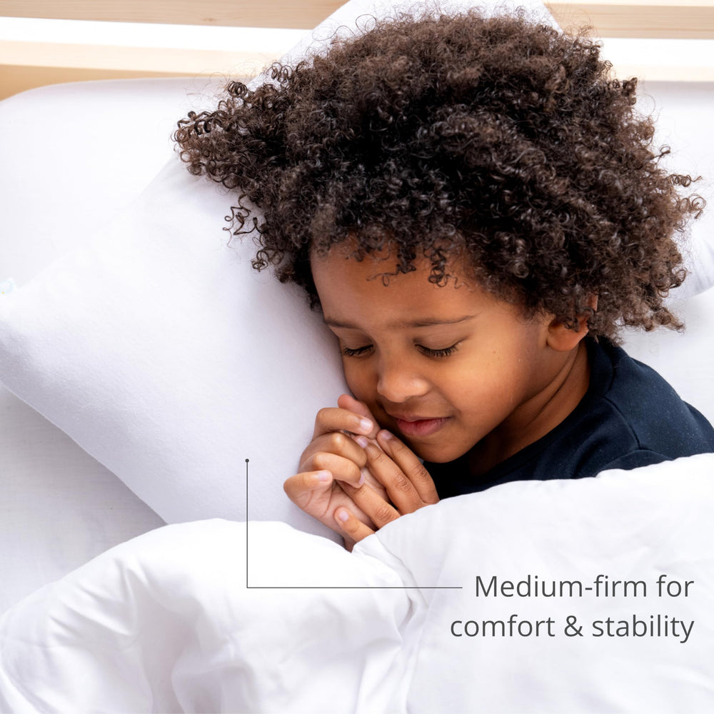 Dreamland Baby breathable cotton pillow offers hypoallergenic comfort for little sleepers.