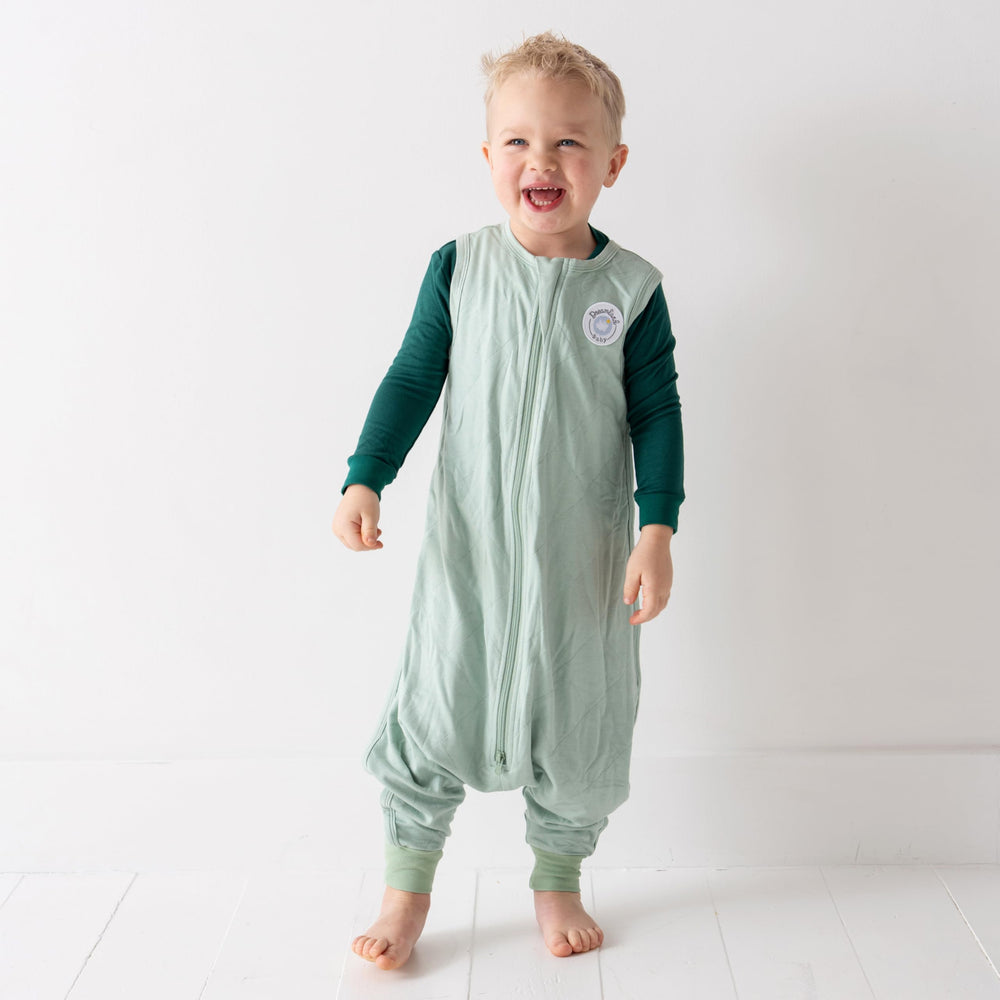 Dreamland Baby sleep sack demonstrates a two-way zipper for easy diaper changes.