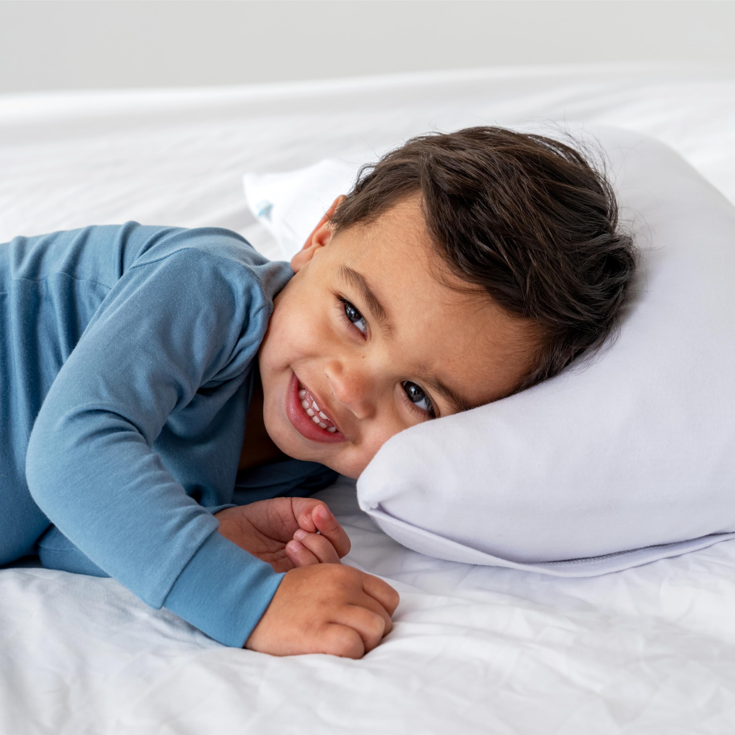 Dreamland Baby travel-size pillow supports on-the-go comfort during trips.