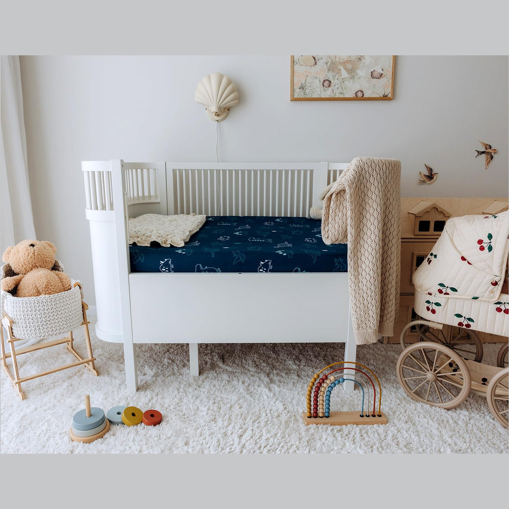 Dreamology 52x28 sheet provides snug fit and easy care for busy parents.