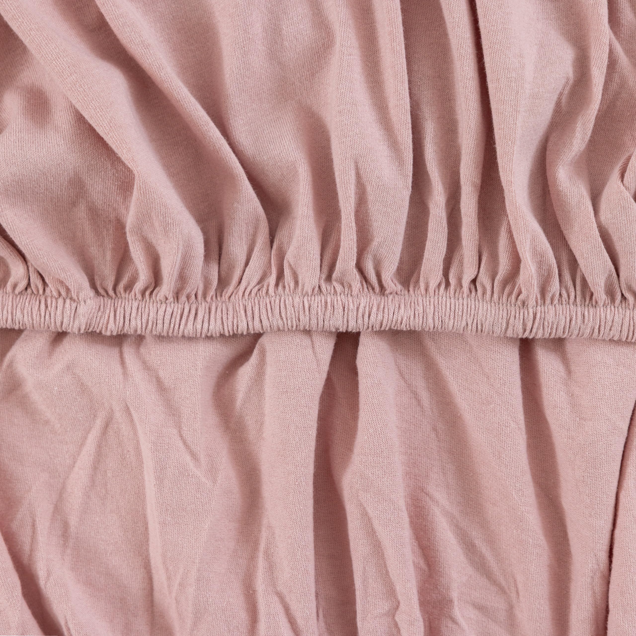 Dreamology Jersey Crib Sheets rose color adds coordinating nursery decor.