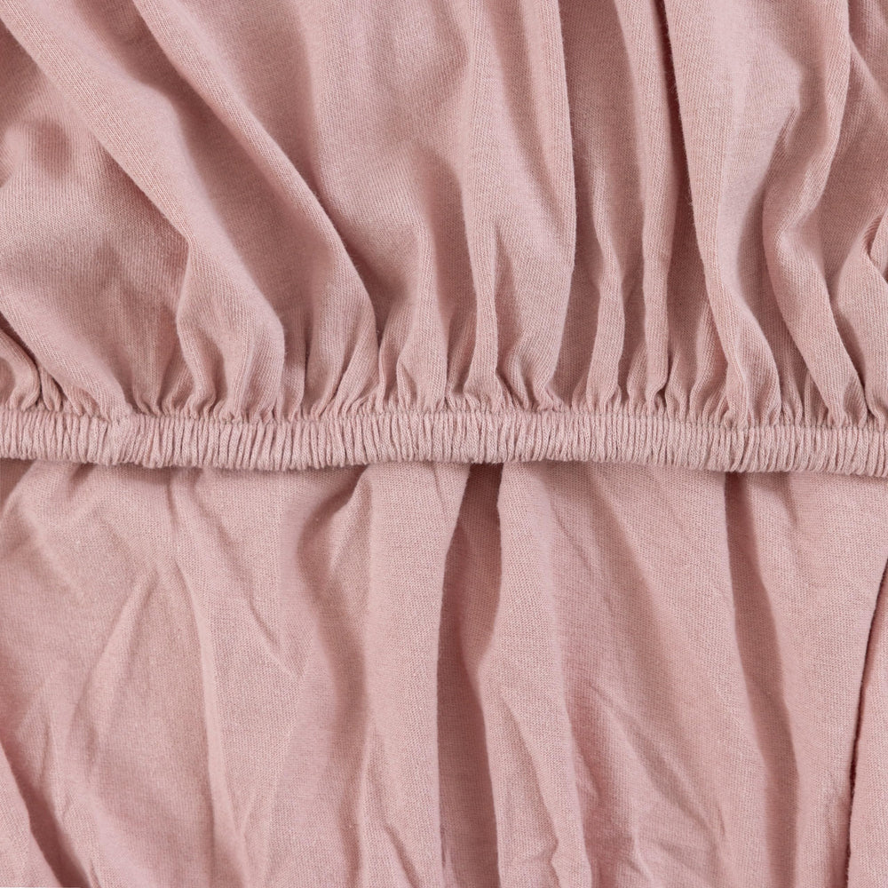 Dreamology Jersey Crib Sheets rose color adds coordinating nursery decor.