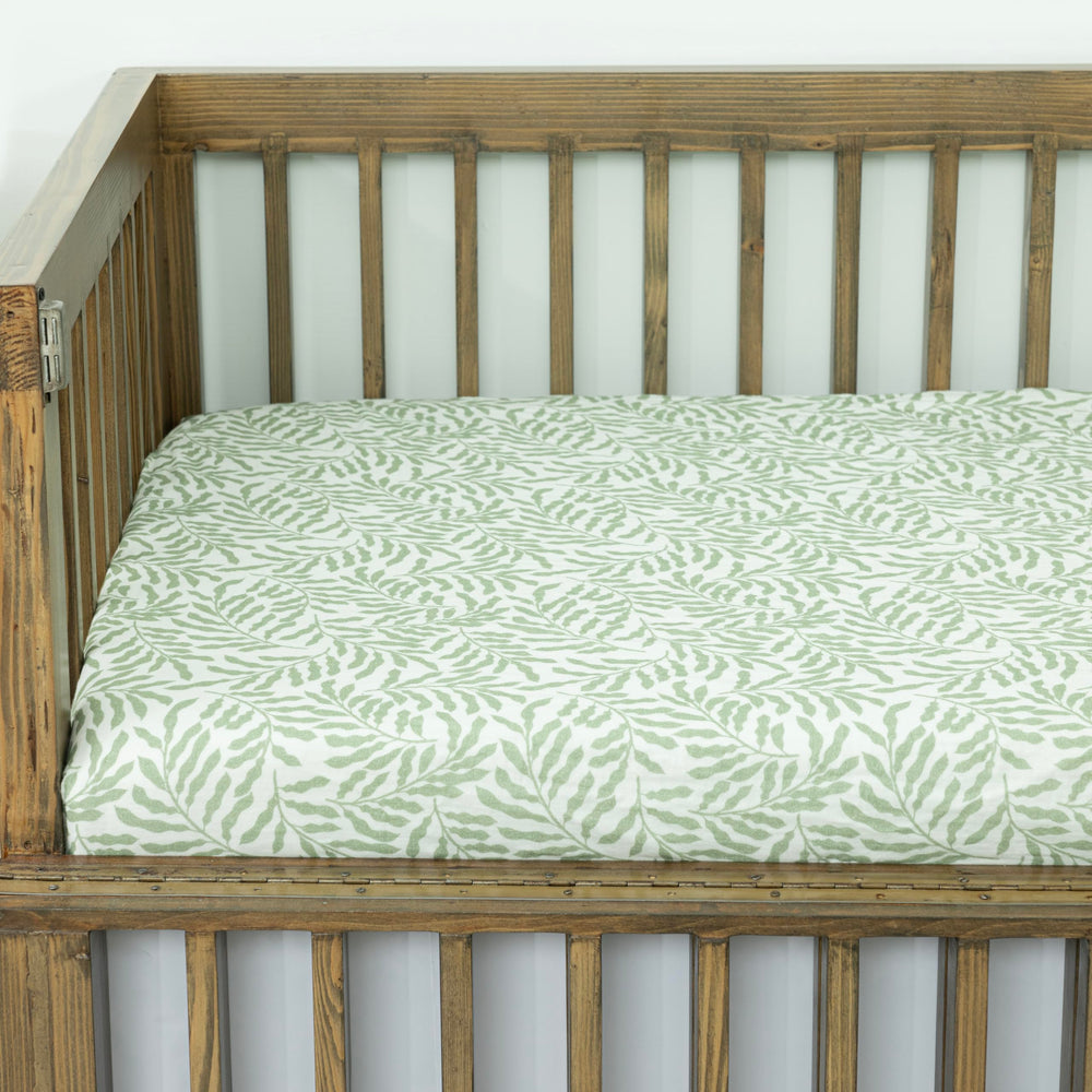Dreamology Leaves muslin crib sheet elastic edges provide slip-free crib fit