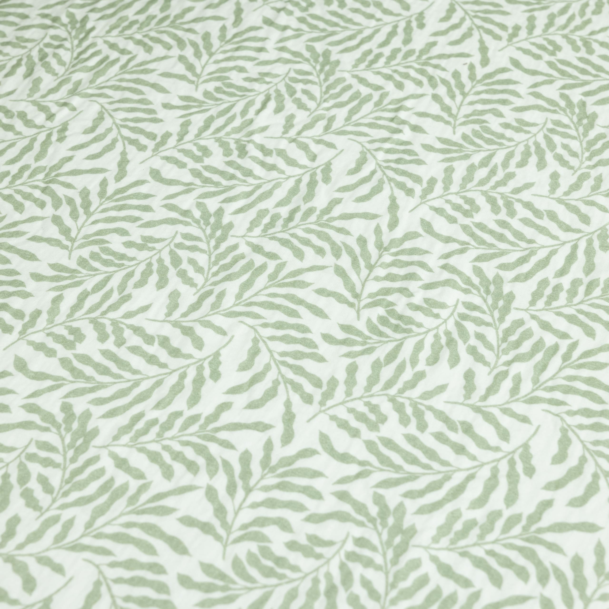 Dreamology Leaves muslin crib sheet machine-washable for easy laundry