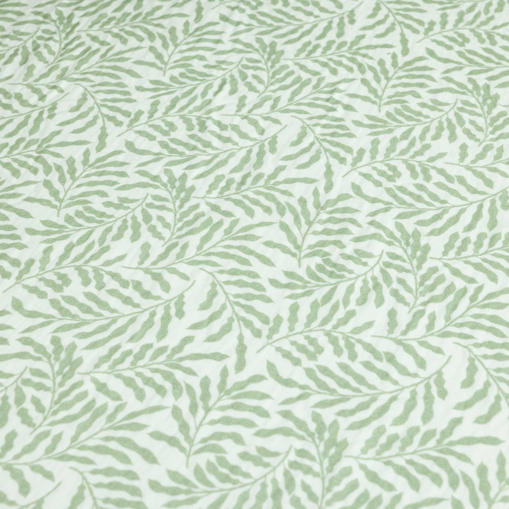 Dreamology Leaves muslin crib sheet machine-washable for easy laundry