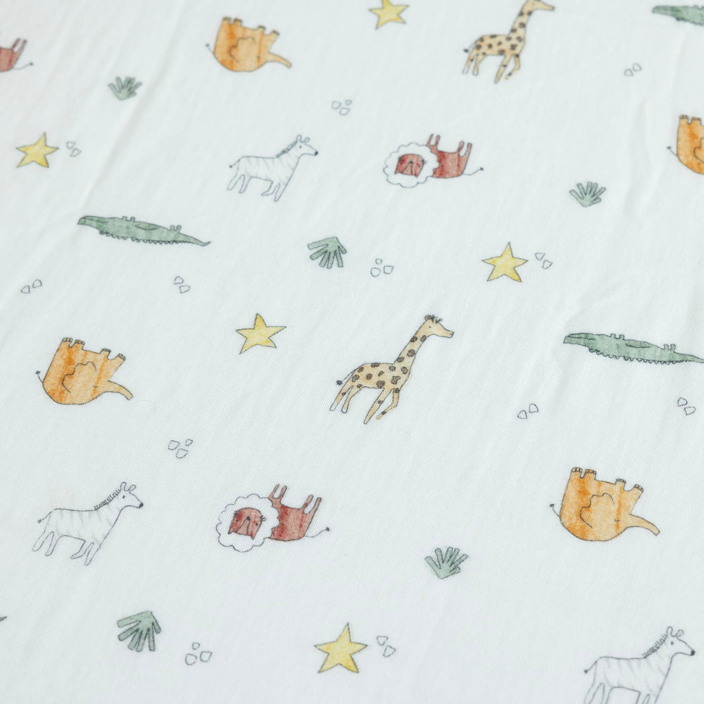 Dreamology muslin crib sheets being machine washed demonstrates easy care.