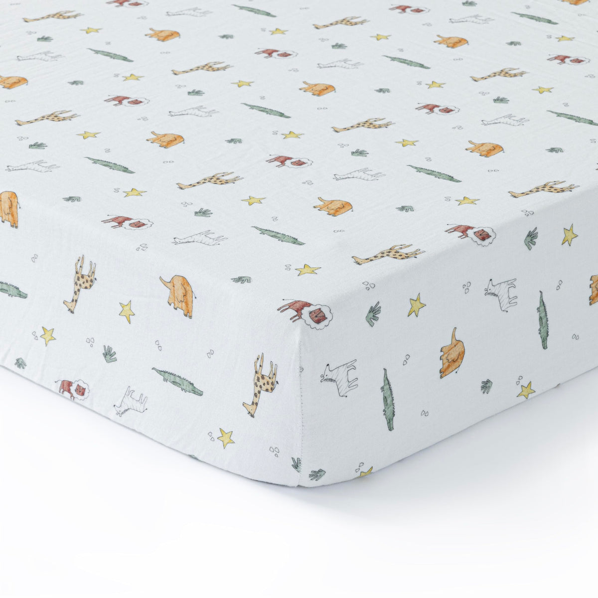 Dreamology muslin crib sheets on a standard crib mattress offer breathable comfort.