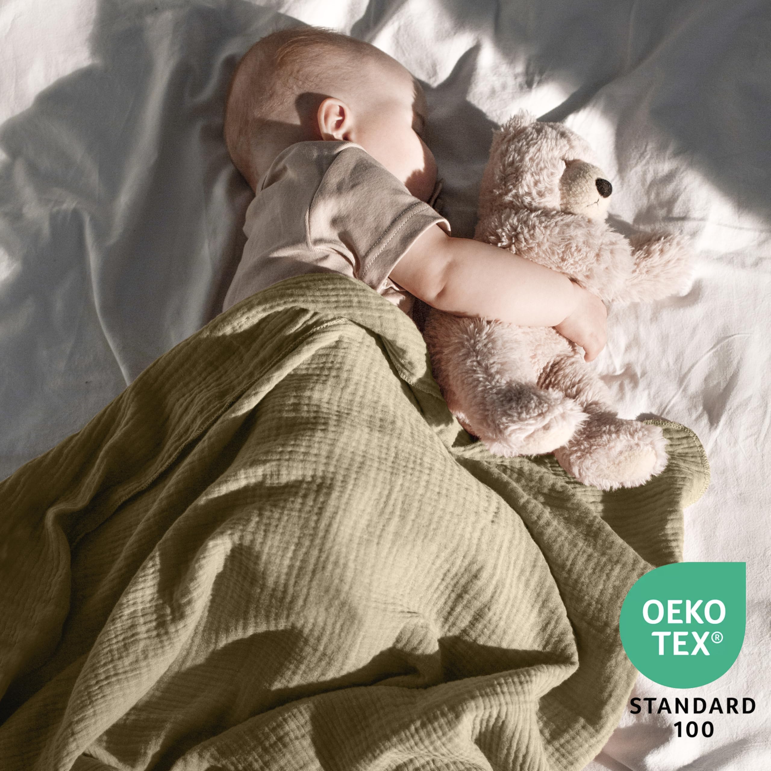 Dreamology muslin swaddle blanket packaged in a gift box for new parents.