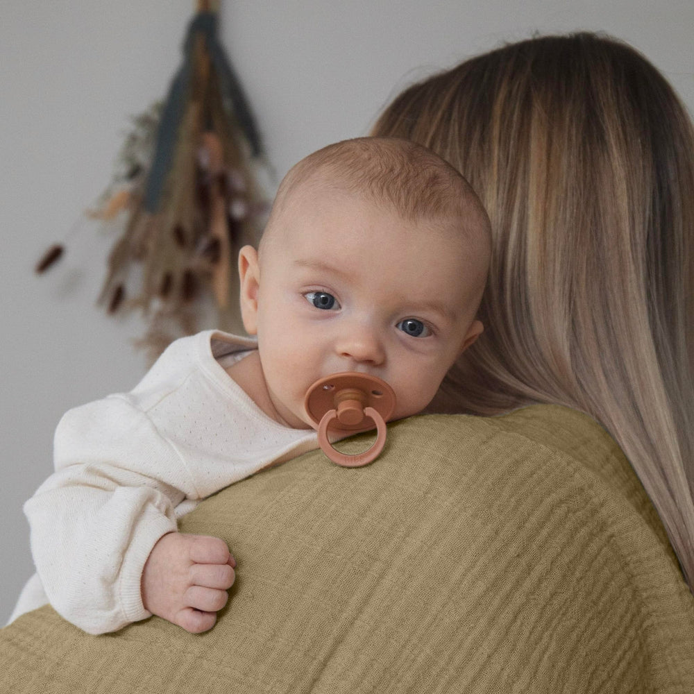 Dreamology muslin swaddle blanket soft close-up showing ultra-soft breathable cotton.
