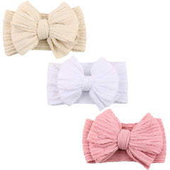 DRESHOW BQUBO baby headband with soft nylon bow for gentle wear.