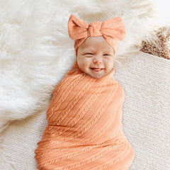 DRESHOW BQUBO bow hat adds cute warmth for newborns during outings.