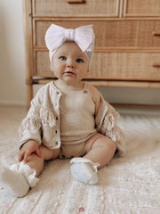 DRESHOW BQUBO handmade bow headband shows delicate craftsmanship and comfortable touch.