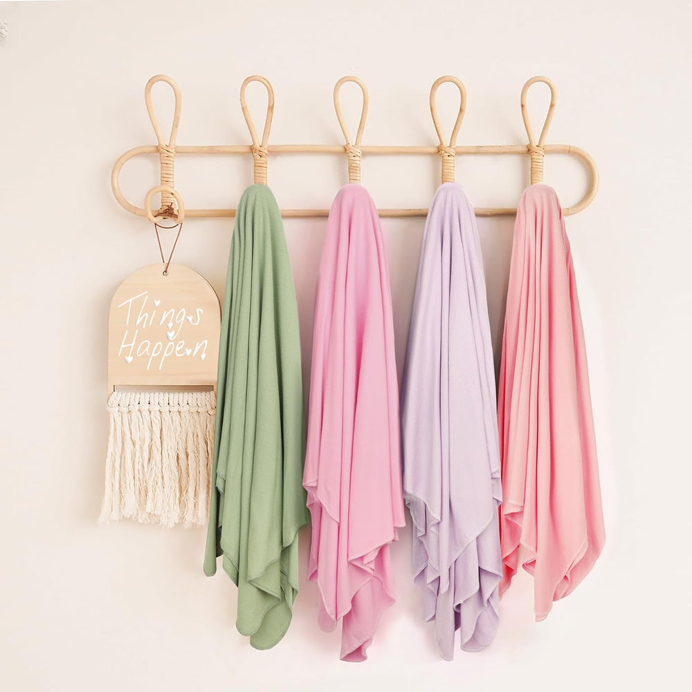 DRESHOW BQUBO mini crib sheet doubles as changing table cover.
