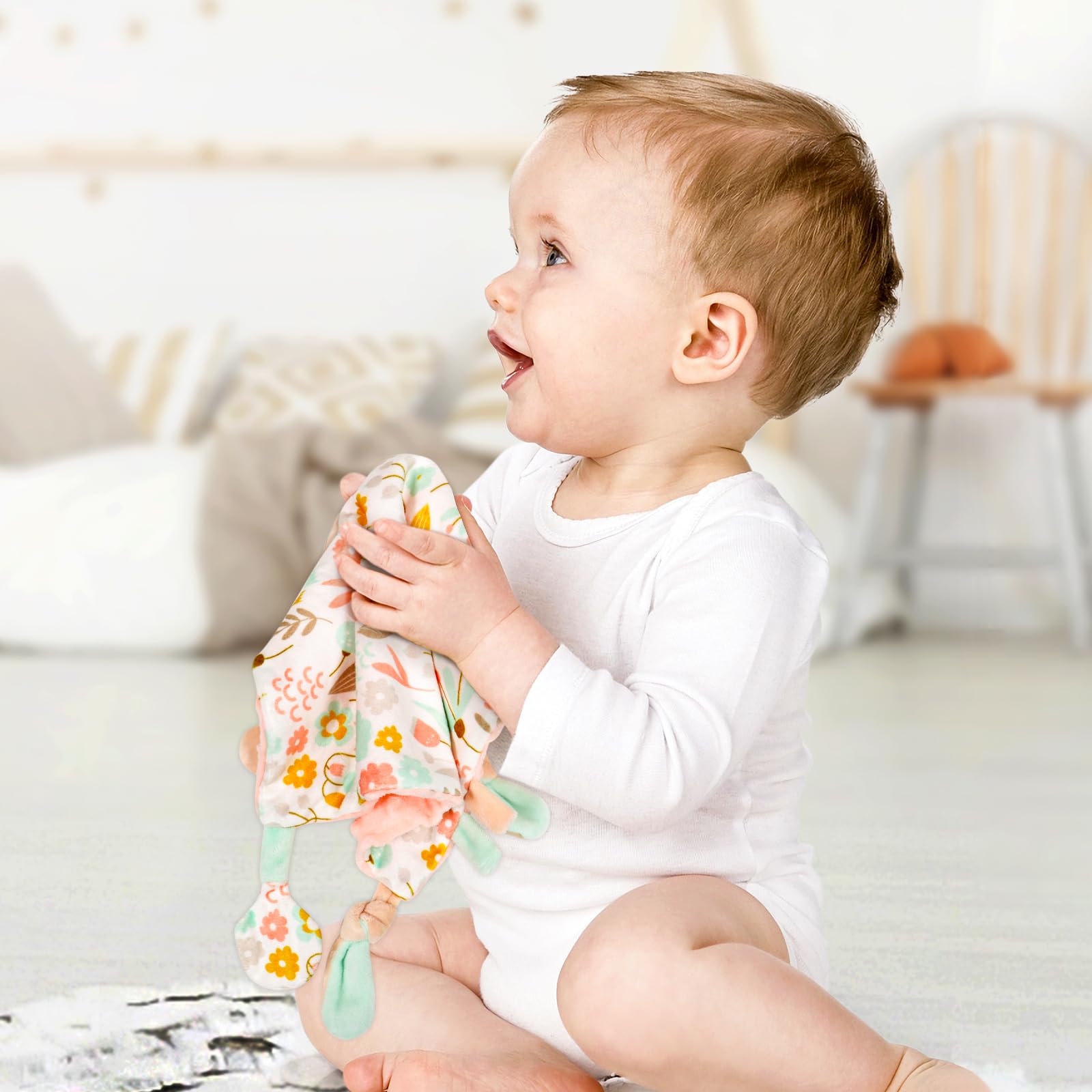 Dr.Rapeti Tag Security Blanket baby holding view emphasizes portability and comfort.