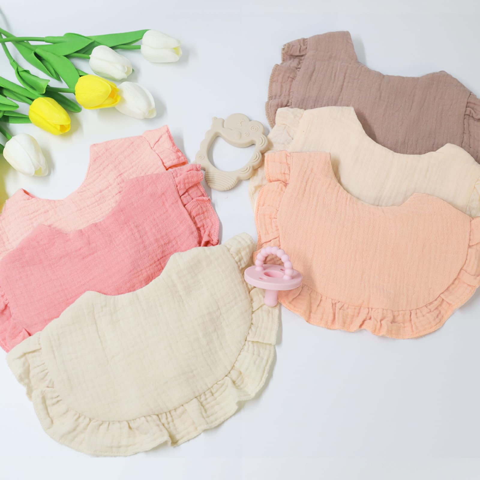 duludulu muslin bibs six-pack Sweet Pink flounce design presentation emphasizes soft, playful look.