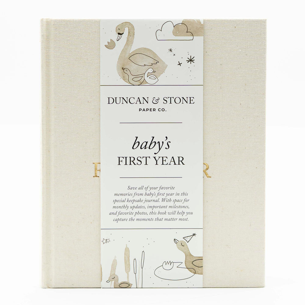 Duncan & Stone Baby First Year Book cover in cream highlights heirloom-quality design for cherished milestones.